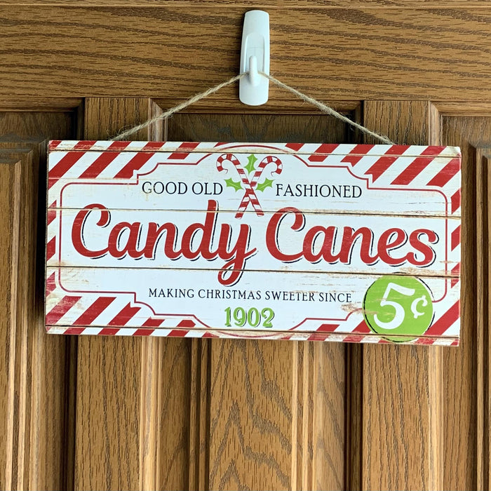 Decorative door hanger with candy cane design 