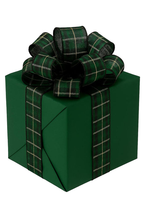 Green gift box with a plaid ribbon on a white background