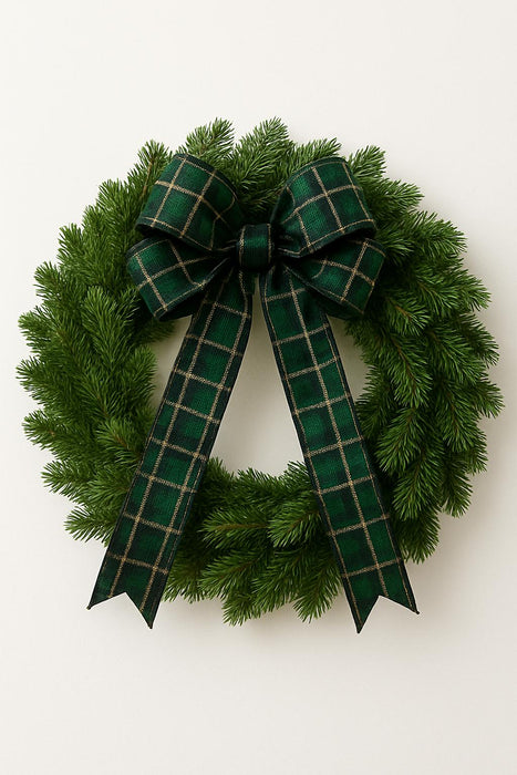 Green wreath with a plaid bow on a white background