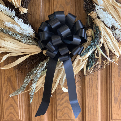 black wreath bow door decoration