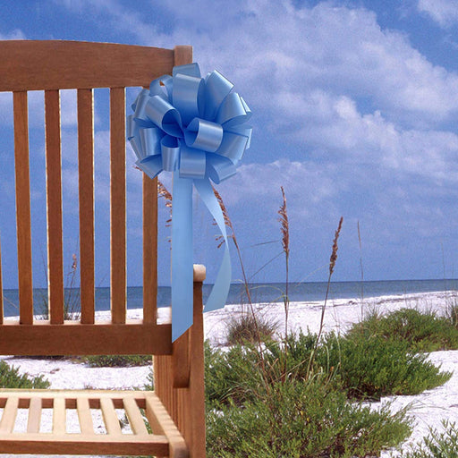 light blue wedding pull bows on a chair for beach wedding