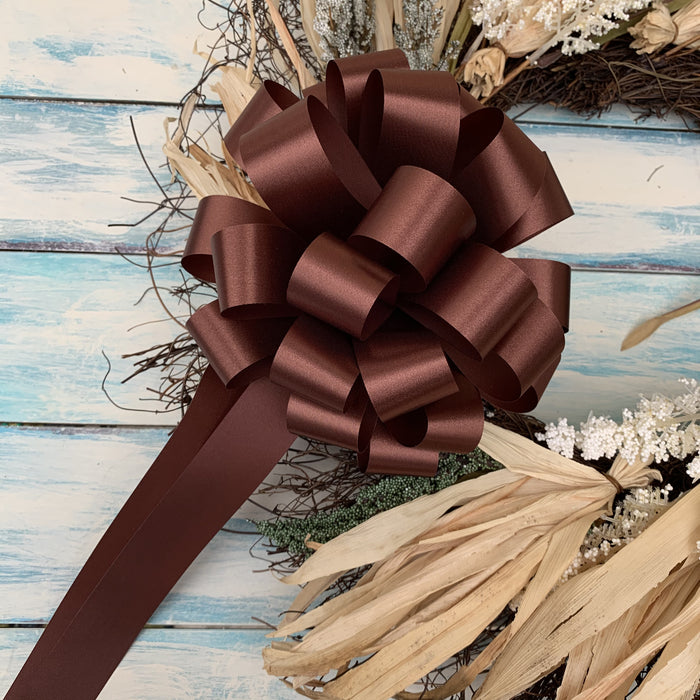 brown bows on a door wreath celebrating Fall festivities