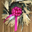 fuchsia pink pull bow on a wreath door decoration