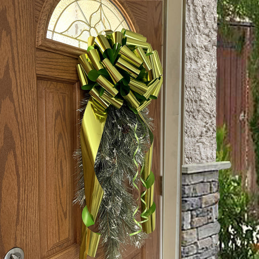 metallic lime green bow on a christmas swag as a door decoration