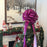 decorate christmas tree with a huge hot pink bow ribbon with long tails