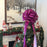 decorate christmas tree with a huge hot pink bow ribbon with long tails