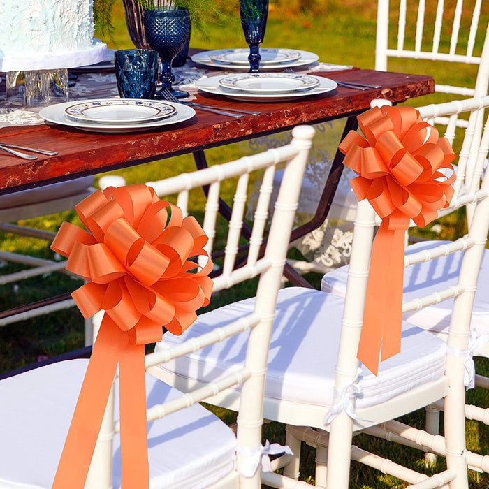 orange wedding theme with chair bows