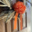 fall themed wreath with an orange instant  bow