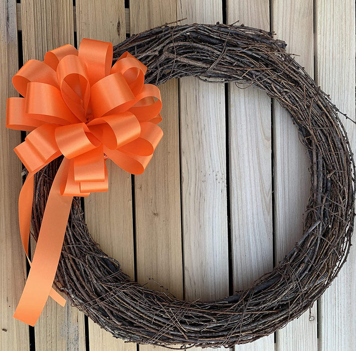 orange bow on a grapevine wreath
