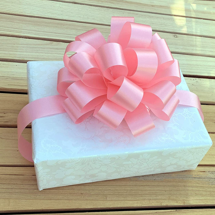 baby  girl shower gift with a big pink bow