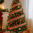 Christmas tree decorated with red gold gittery ribbon garland