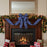 Decorated fireplace with a blue and white bow, Christmas stockings, and presents.