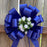 white-rosebuds-and-tulle-tails-on-royal-blue-bows