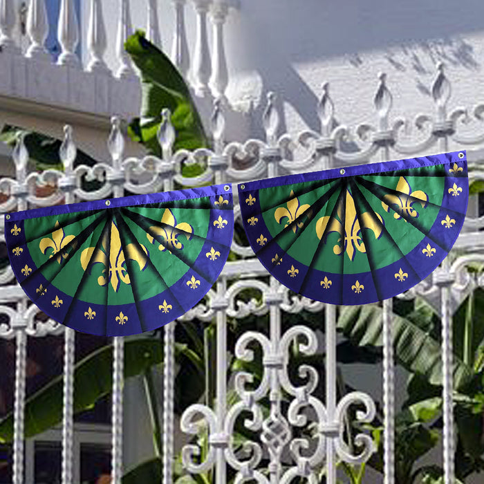 small mardi gras flags in purple gold and green on a fence