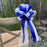 white-and-royal-blue-summer-wedding-pew-bows