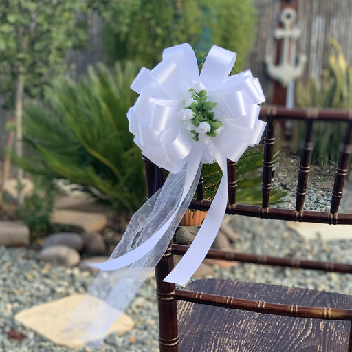 white-wedding-pew-bows-with-flowers